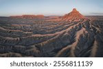 Factory Butte in Utah features striking, otherworldly landscapes with unique rock formations and vibrant desert hues. Perfect for photography.