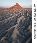 Factory Butte in Utah features striking desert landscapes, with unique rock formations and vibrant colors, perfect for photography and exploration.