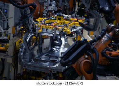 Factory, car manufacturing, innovative robotic welding line - Shutterstock ID 2112647072