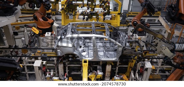 Factory, car manufacturing, innovative robotic
welding line