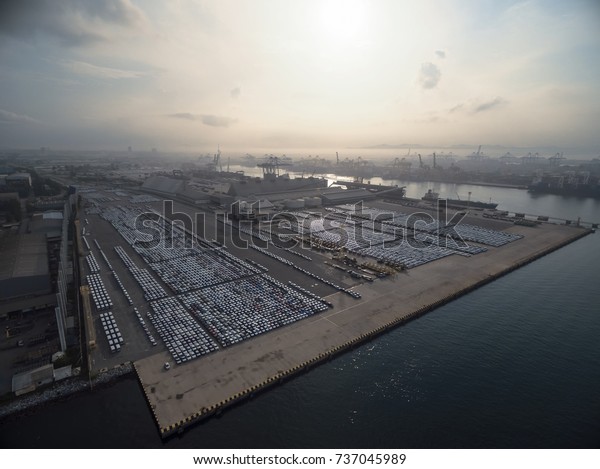 Factory car in\
shipping dock at sunset\
.\
