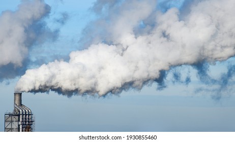 Factory Chimney Fumes Emitting Pollution To The Atmosphere. Co2 And Greenhouse Gases Emissions.