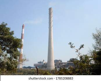 Factory Chimney, Industrial Smoke Chimneys, Tall Industrial Factory Chimney Smokestacks Of Jute Mill Industry In Ganges Riverside Of Kolkata West Bengal India South Asia Pacific