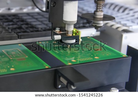 Factory for the electronic production. Technological process of soldering and assembly chip components on pcb board. Automated soldering machine inside 