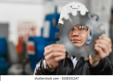 factory engineer checks the quality of the manufactured part - Powered by Shutterstock