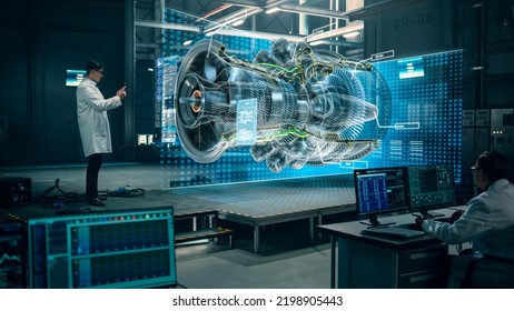 Factory: Engineer Holds Tablet Computer, Designes Engine in Augmented Reality App. Industry 4.0 Concept: Research, Development, Visualization, Digitalization of Green Energy