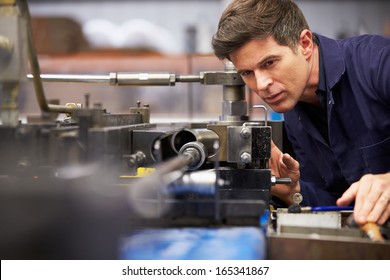 Factory Engineer Operating Hydraulic Tube Bender - Shutterstock ID 165341867