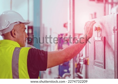 factory engineer staff pressing Emergency Stop Switch machine  malfunctioning for safety