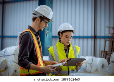 Factory Engineer Under Inspection And Checking Quality Production Process On Face Mask Manufacture  Station By  Wearing Casual Uniform And Safety Helmet In Factory Plantation.