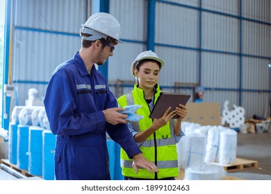 Factory Engineer Under Inspection And Checking Quality Production Process On Face Mask Manufacture  Station By  Wearing Casual Uniform And Safety Helmet In Factory Plantation.