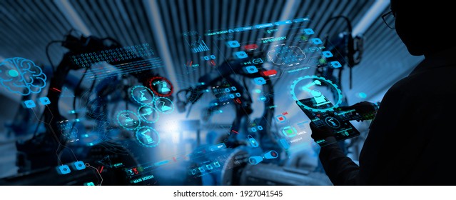 Factory Female Industrial Engineer working with automation robot arms machine in intelligent factory industrial on real time monitoring system software.Digital future manufacture. - Shutterstock ID 1927041545