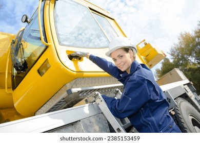 factory female worker with a crane - Powered by Shutterstock