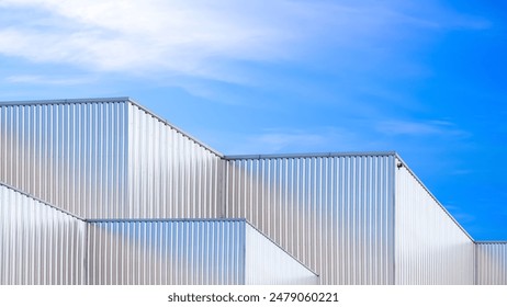 Factory industry, Architecture Building with Aluminium Facade on Blue Sky Background, Backdrop Wall Metal Corrugated Steel Surface Pattern, Warehouse Construction in Geometric Modern Design - Powered by Shutterstock