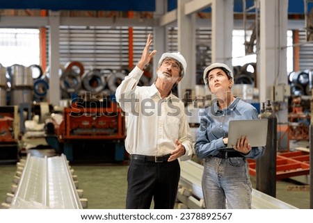 Factory manager or executive make visit metalwork manufacturing factory tour and inspect heavy steel industrial machinery showcase leadership quality as engineering inspection supervisor. Exemplifying