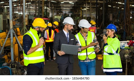 The Factory Manager Is Meeting With The Team Engineers Or Technicians Within The Warehouse To Plan Work And Maintain Industry Standards.