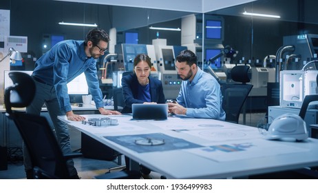 Factory Office Meeting Room: Team of Engineers Gather Around Conference Table, They Discuss Project Blueprints, Inspect Mechanism, Find Solutions, Use Laptop. Industrial Technology Factory