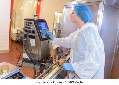 Factory operative setting up machine