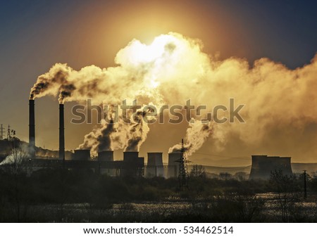 Factory pipe polluting air, smoke from chimneys against sun, environmental problems, ecological theme, industry scene