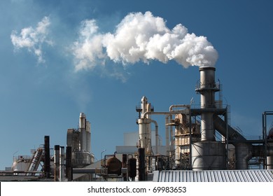Factory smoke pipe sending smoke to the atmosphere. - Shutterstock ID 69983653
