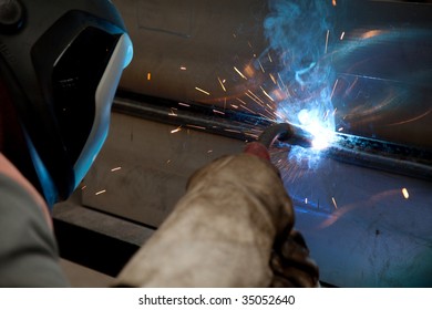 Factory welder doing his job