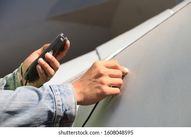 Factory worker checking the color quality
