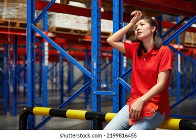 Factory Worker Feeling Tired From Hard Work In The Warehouse Storage