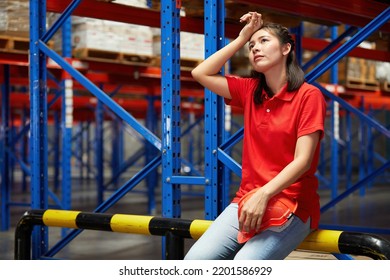 Factory Worker Feeling Tired From Hard Work In The Warehouse Storage