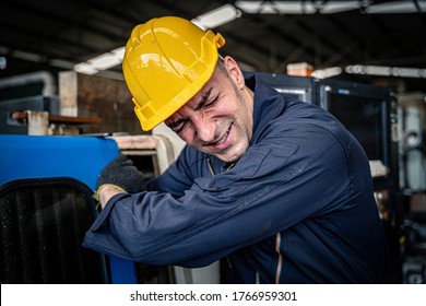 Factory Worker Got His Arm Stuck In The Machine. Workplace Accident. Occupational Hazard.