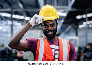 Factory Worker Man Or Mechanics Smiling And Touching Protective Helmet In Machinery Repair Factory, Feeling Happy, Positive Thinking Work, Services Maintenance Excellent.