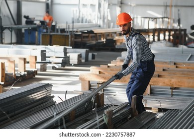 Factory worker measures the metal profile. - Powered by Shutterstock