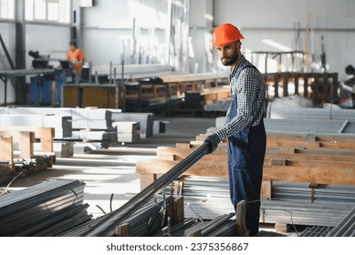 Factory worker measures the metal profile. - Powered by Shutterstock