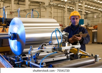 Factory Worker Using Steel Coil Processing Machine - A Series Of METAL INDUSTRY Images.