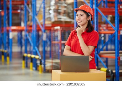 Factory Worker Or Warehouser Smiling With Laptop Computer And Thinking Pose In Warehouse Storage