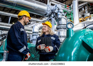 Factory Workers Checking Pumps And Generators In Petrochemical Refinery Industry.