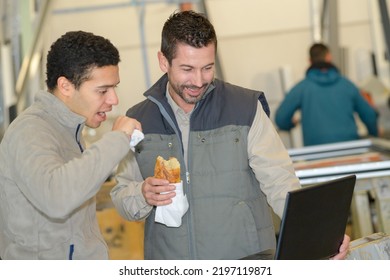 factory workers eating bread for snack
