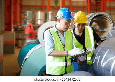 factory workers or engineers meeting and planning from work in the factory - Powered by Shutterstock