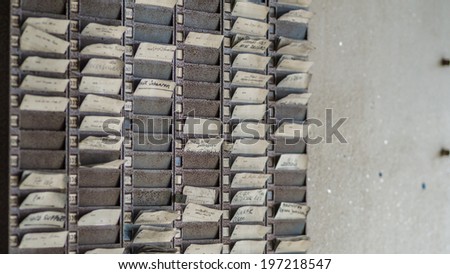 factory workers time cards for use in a  punch clock