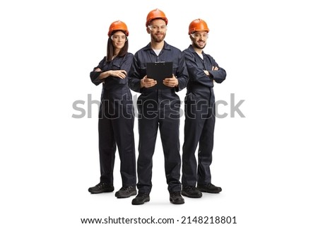 Factory workers in uniforms wearing helmets and goggles isolated on white background