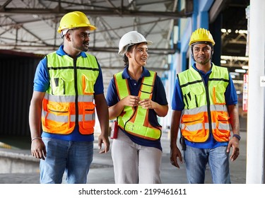 Factory Workers Walking And Talking About Work Or Project In The Warehouse Storage