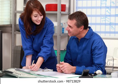 factory workers working in the office