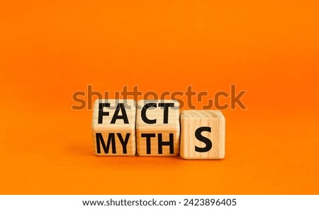 Facts or myths symbol. Concept word Myths and Facts. Beautiful orange table orange background. Business and facts or myths fact myth concept. Copy space.