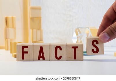 Facts Symbol. The Concept Word 'facts' On Wooden Cubes. Beautiful White Table, White Background, Copy Space. Business, Fact And Facts Concept.