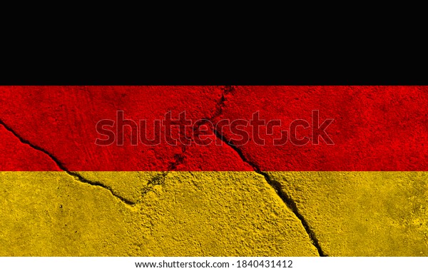 Faded Germany national flag pattern on broken\
cracked concrete wall, German political conflict concept texture\
background wallpaper