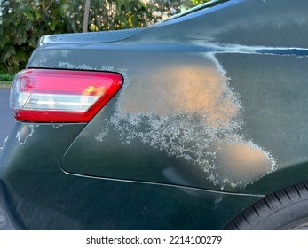 Faded paint on car color surface. - Shutterstock ID 2214100279