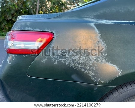Faded paint on car color surface.