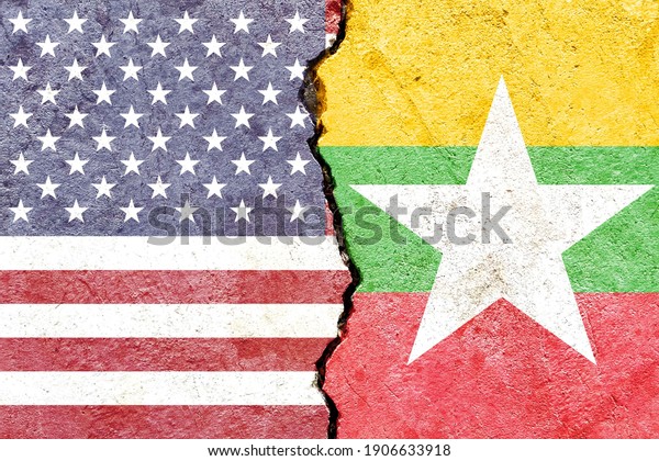 Faded USA VS Myanmar\
national flags isolated on weathered cracked wall background,\
abstract US Burma politics relationship friendship conflicts\
concept texture wallpaper