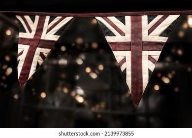 Faded vintage Union Jack bunting with bokeh background. Ideal for platinum jubilee celebrations.  - Shutterstock ID 2139973855
