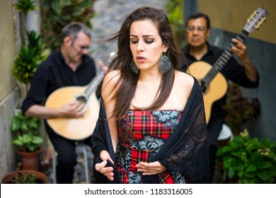 Fado Band Performing Traditional Portuguese Music On The Street Of Alfama, Lisbon, Portugal