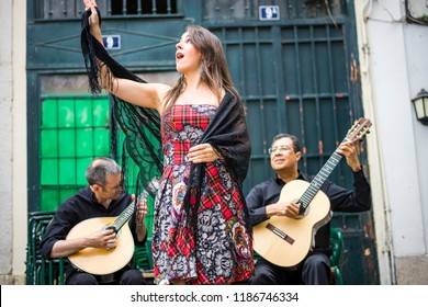 Fado Band Performing Traditional Portuguese Music On The Square Of Alfama, Lisbon, Portugal