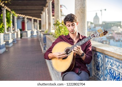 Fado Musician Playing On Portuguese Guitar In Lisbon, Portugal 